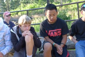 Pastor-Travis-and-Aiden-praying-at-RTLC-Confirmation-Camp